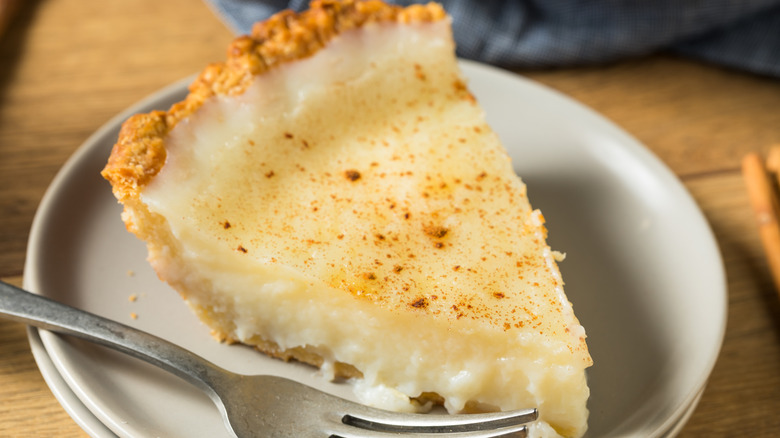Slice of sugar cream pie with fork