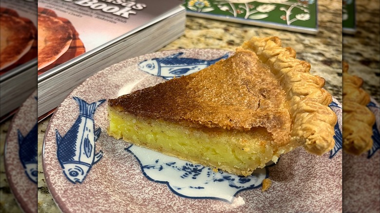 Slice of vinegar pie on plate