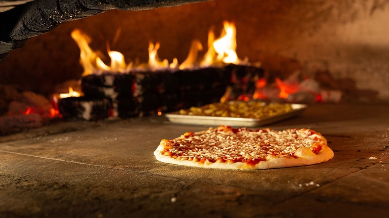 Bertucci's pizza cooking in the wood-fired pizza oven