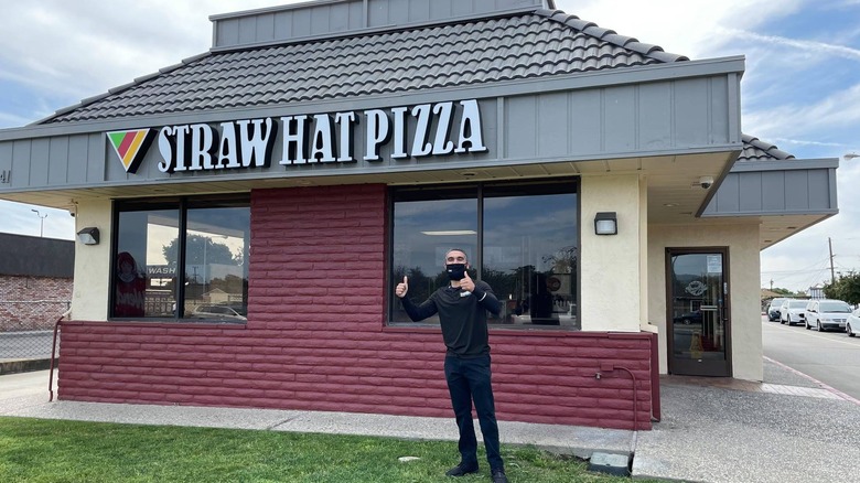 Owner of Straw Hat Franchise in front of restaurant