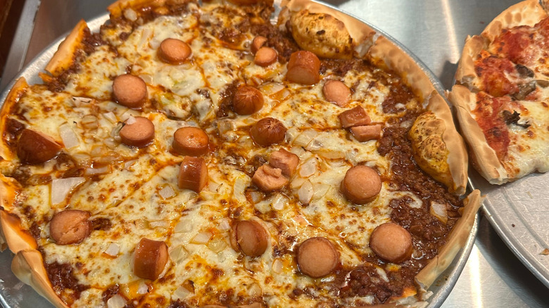 Pizza topped with sliced hot dogs