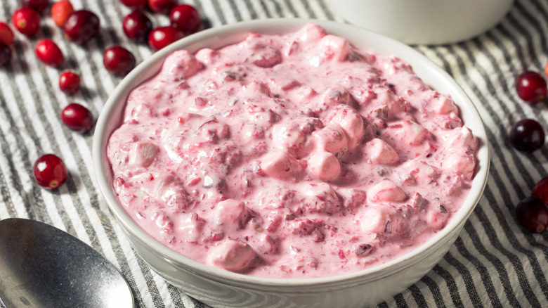 Cranberry fluff salad in a white bowl