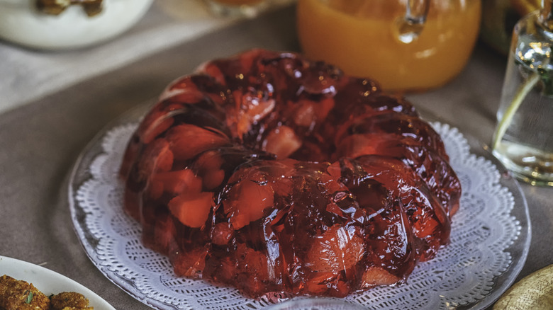 Molded red gelatin salad on a platter