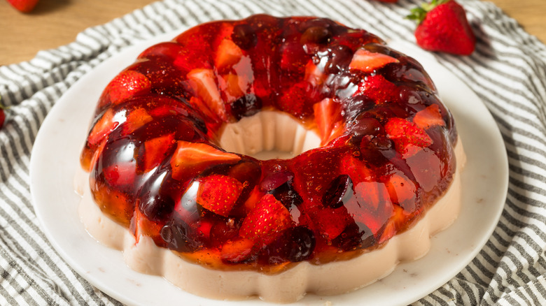 Molded fruit salad on a white plate
