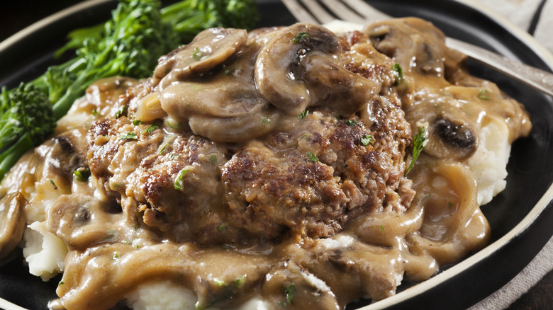 Salisbury steak on a plate with a fork