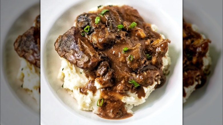 Smothered steak with mashed potatoes
