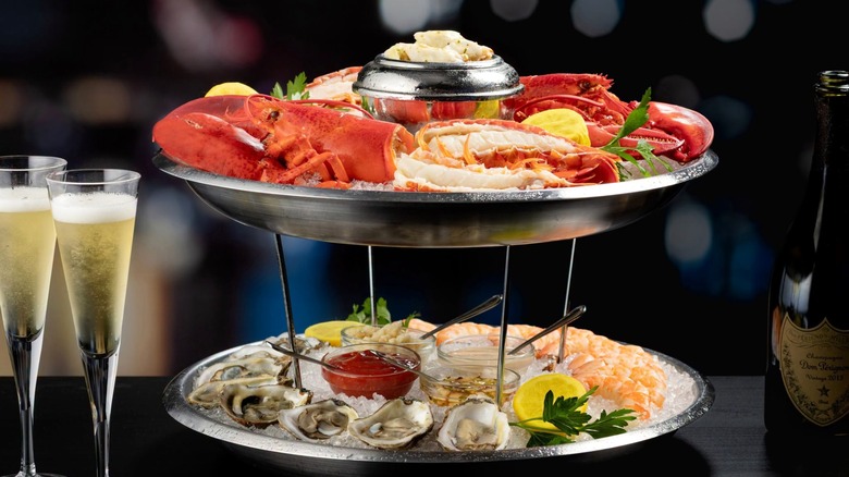 Seafood dish at Eddie V's with lobster, shrimp, mussels, and Champagne.