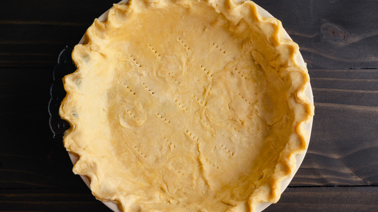 A top-down view of pie crust in a pan
