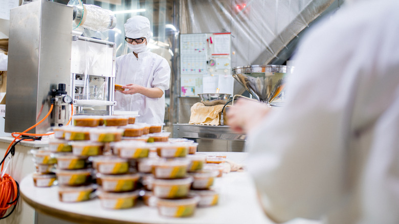 People working in a food manufacturing facility