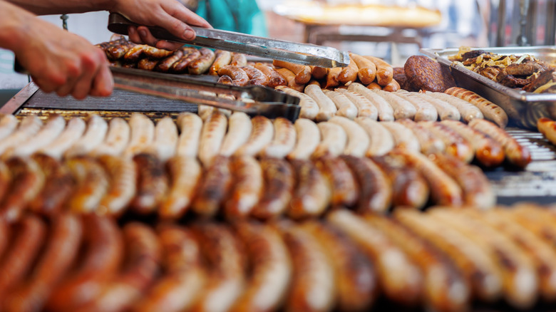 Sausage being cooked on a grill