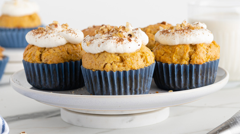 Carrot cupcakes with frosting and toasted nuts