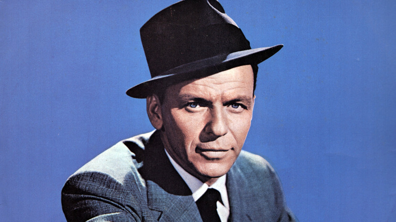 Studio photo of Frank Sinatra wearing a suit and a hat