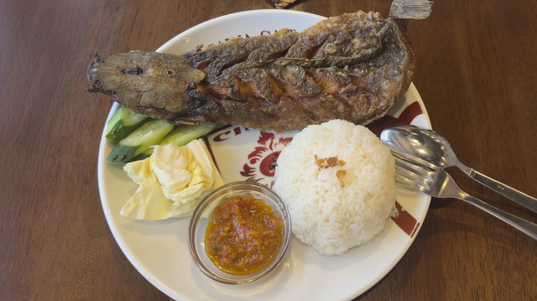 Indonesian fried fish with rice and sambal