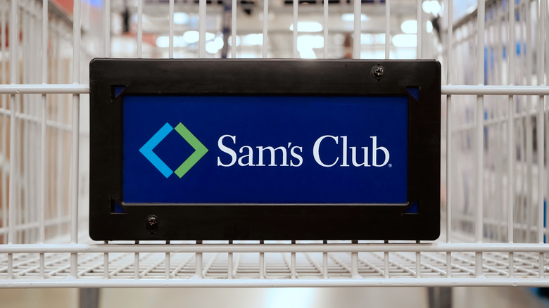 Sam's Club placard on the front of an empty shopping cart