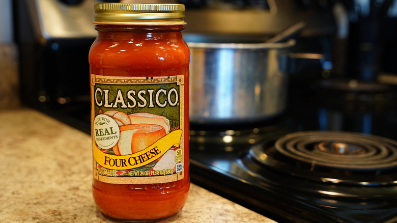 jar of pasta sauce on kitchen counter