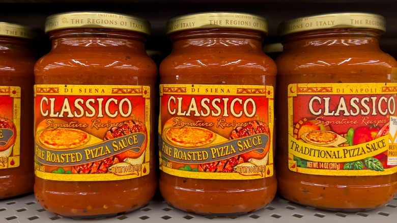Close-up of different varieties of jarred pizza sauce