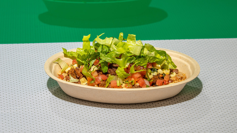 chipotle burrito bowl with lettuce on a backdrop