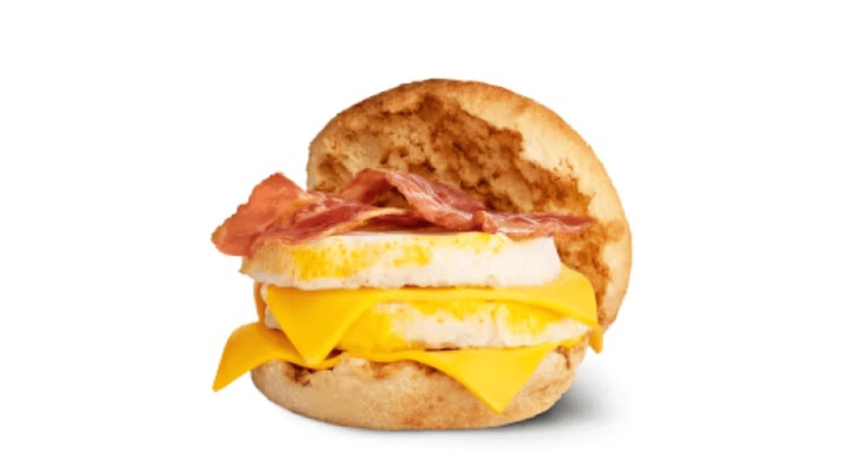 A Bacon and Egg McMuffin with two round egg patties on it.