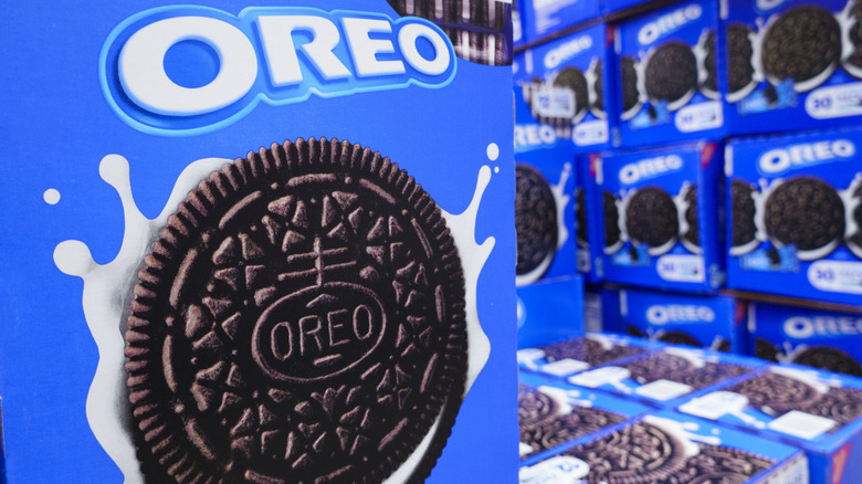 A large Oreo display with several boxes of Oreos inside of a grocery store.