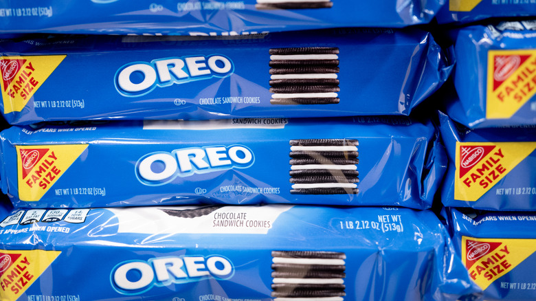 Packages of Oreo cookies stacked on a grocery store shelf