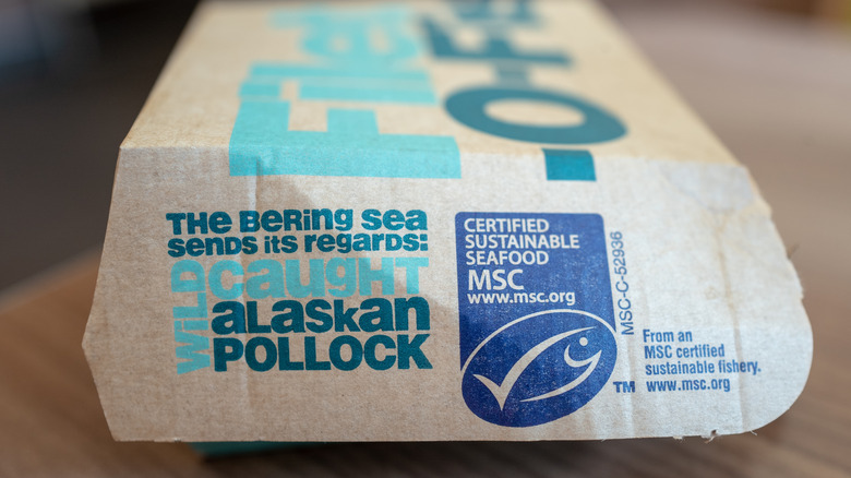 A Filet-O-Fish box from McDonald's that notes its use of wild-caught Alaska Pollock on the side