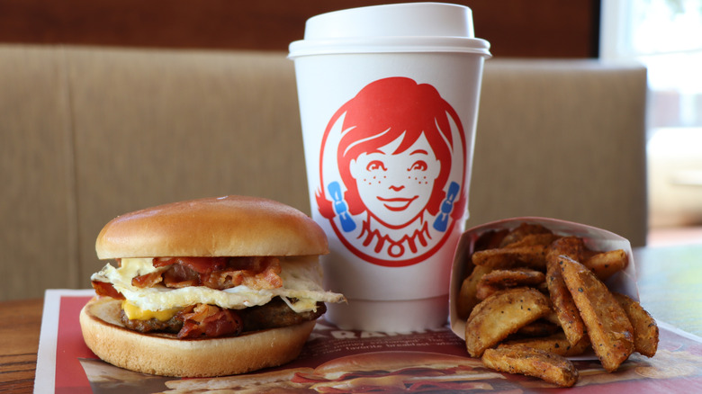 Wendy's breakfast sandwich, coffee, and fried potatoes