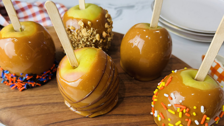 Caramel apples on serving board