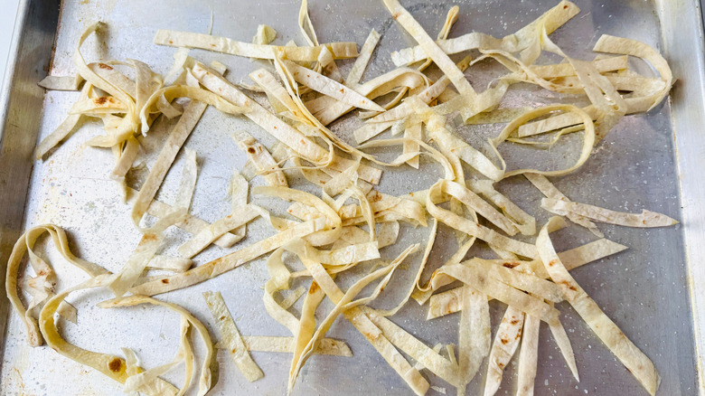 Tortilla strips on baking sheet