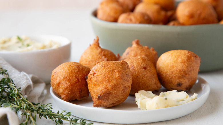 hush puppies on plate with lemon honey butter