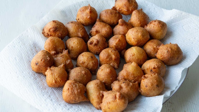 hush puppies draining on paper towel lined plate