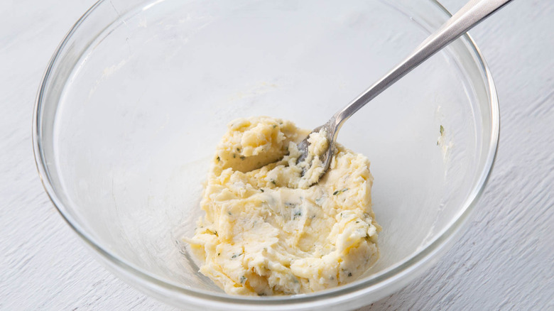 mashing lemon honey butter in bowl