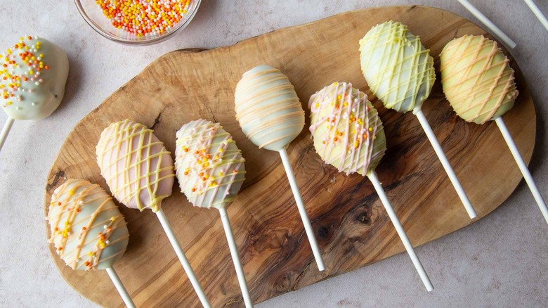 Easter egg cake pops on a board