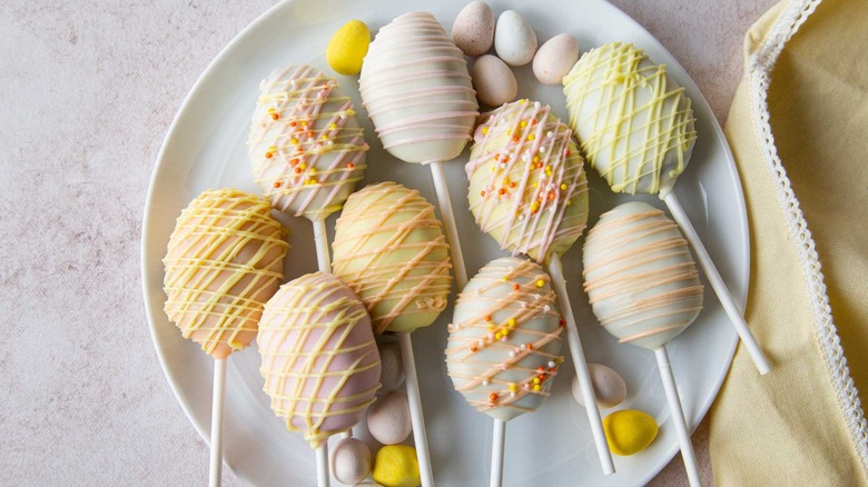 Easter egg cake pops on a white plate