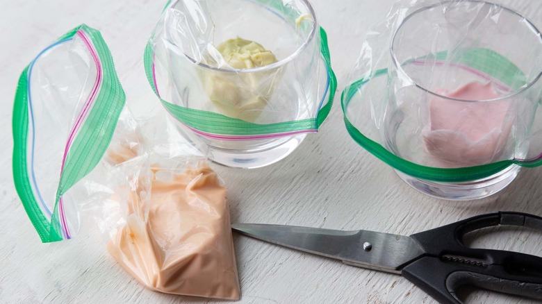 colored glaze in plastic bags with scissors