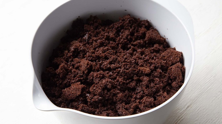 chocolate cake crumbs in a white bowl