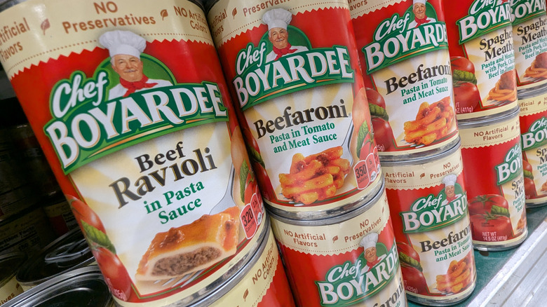 Cans of Chef Boyardee pasta on a store shelf