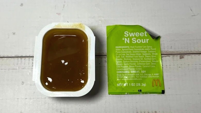 An opened carton of McDonald's Sweet 'N Sour Sauce.