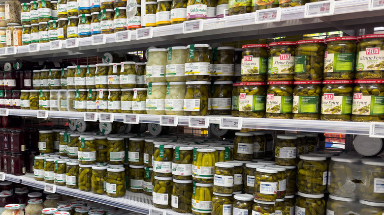 Supermarket aisle with various jarred pickles