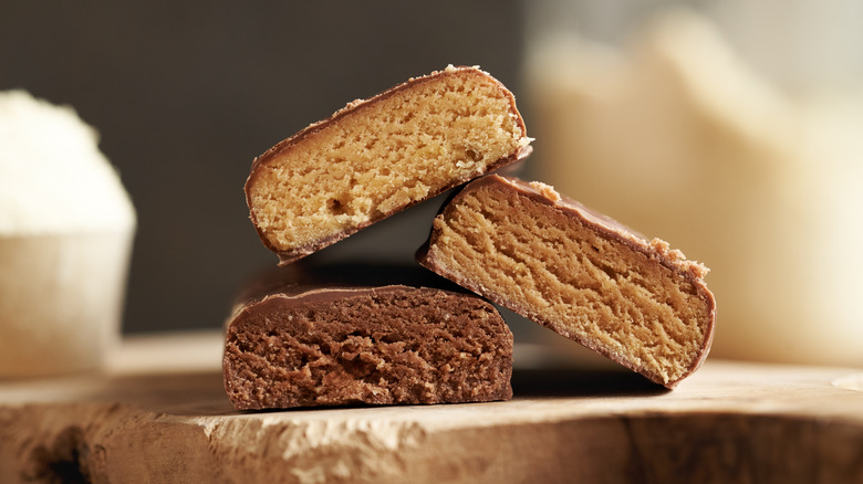 Three protein bars stacked on top of one another.