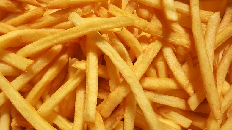 Closeup of large pile of golden fast food-style french fries