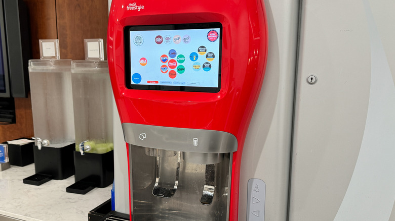 A Coca-Cola Freestyle Machine next to two water tanks