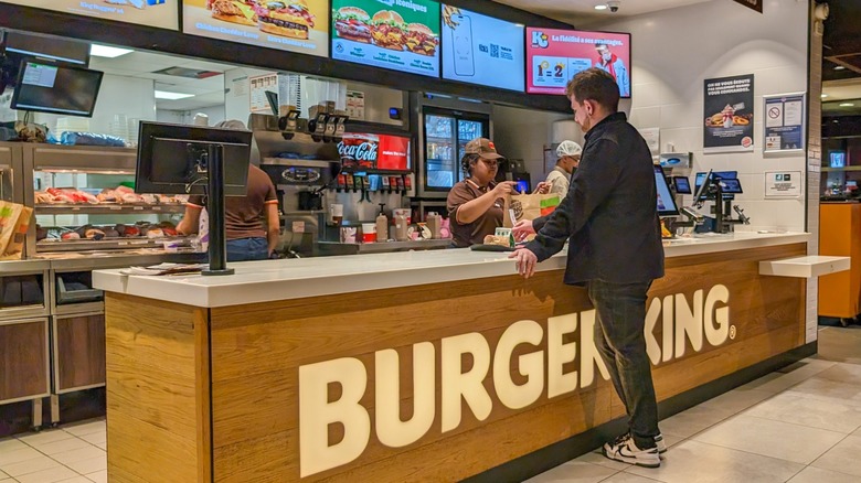 Person ordering from counter at Burger King