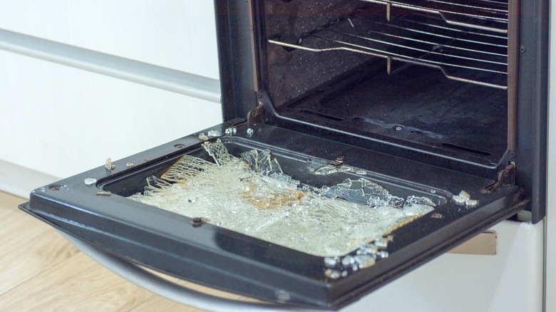 Broken oven door with shattered glass