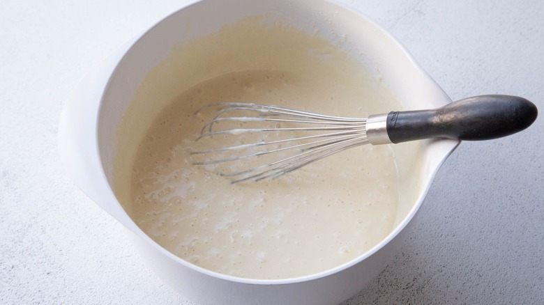 Pancake batter and whisk in bowl