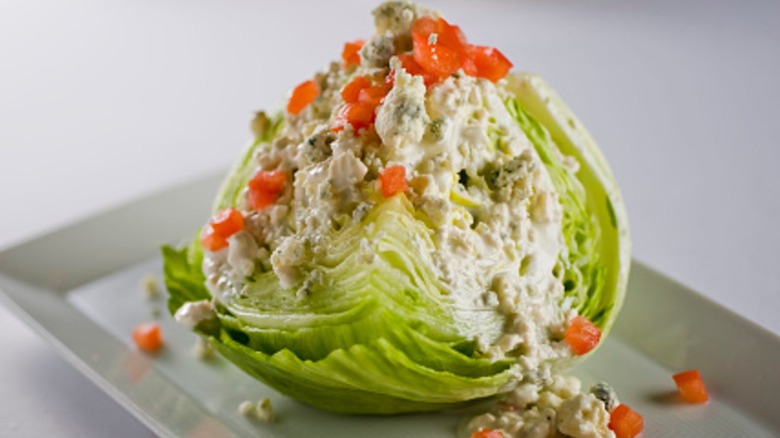 wedge salad on a rectangular white plate