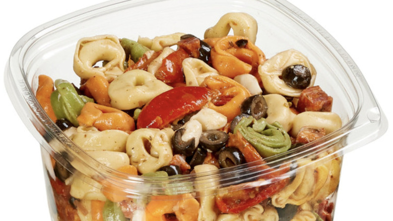 Costco tortellini pasta salad in a plastic retail container.