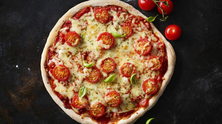 pizza topped with cherry tomatoes