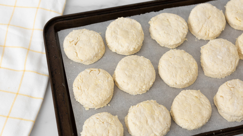 Biscuit dough shaped in circles on a baking tray