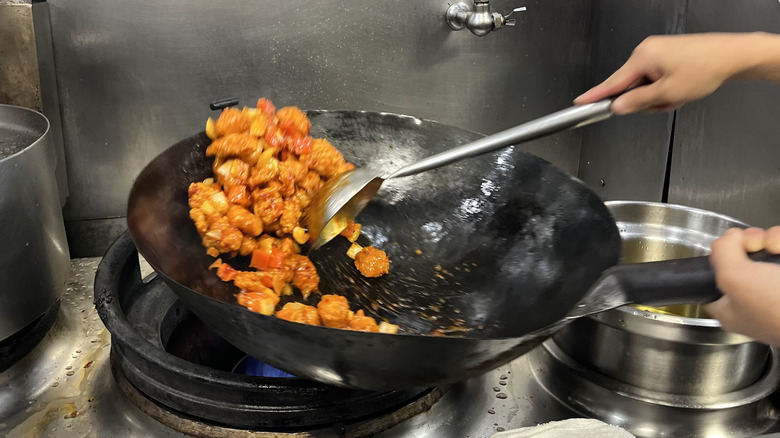 A hot wok with Panda Express Dynamite Sweet and Sour Chicken