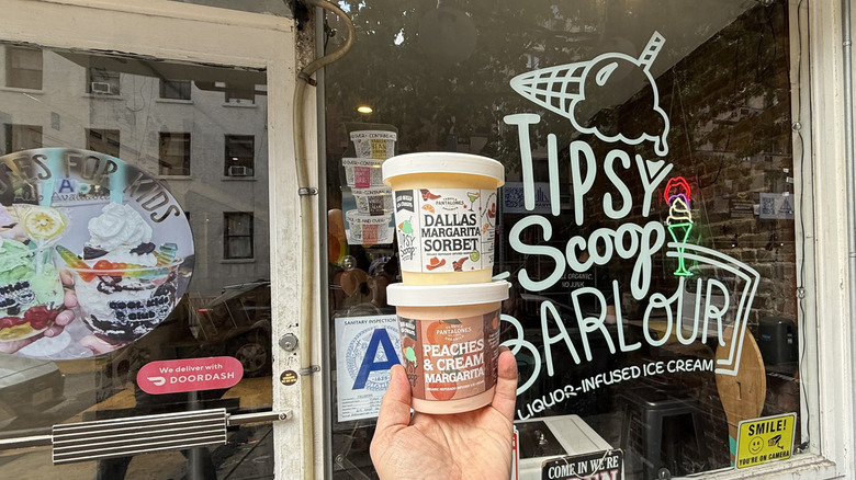 pints held outside of a Tipsy Scoop Barlour